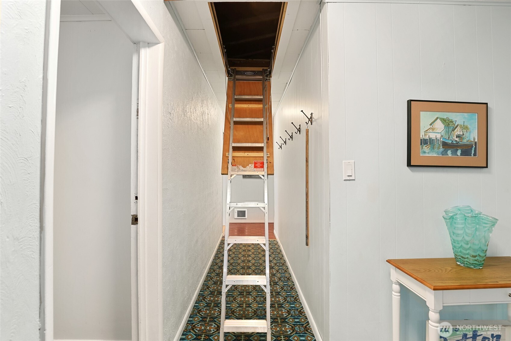 215 H Street Cosmopolis, WA 98537 - Photo 28 of 40 a view of a hallway to a bedroom with wooden floor and entryway