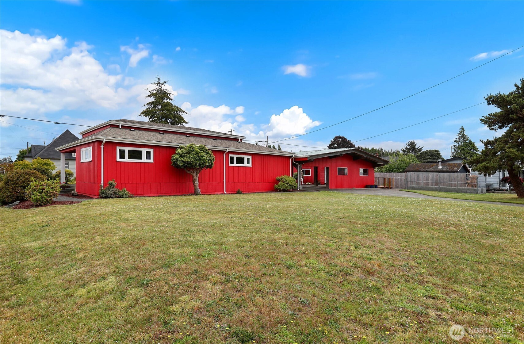 215 H Street Cosmopolis, WA 98537 - Photo 35 of 40 a yellow and red umbrella sitting in the middle of a yard