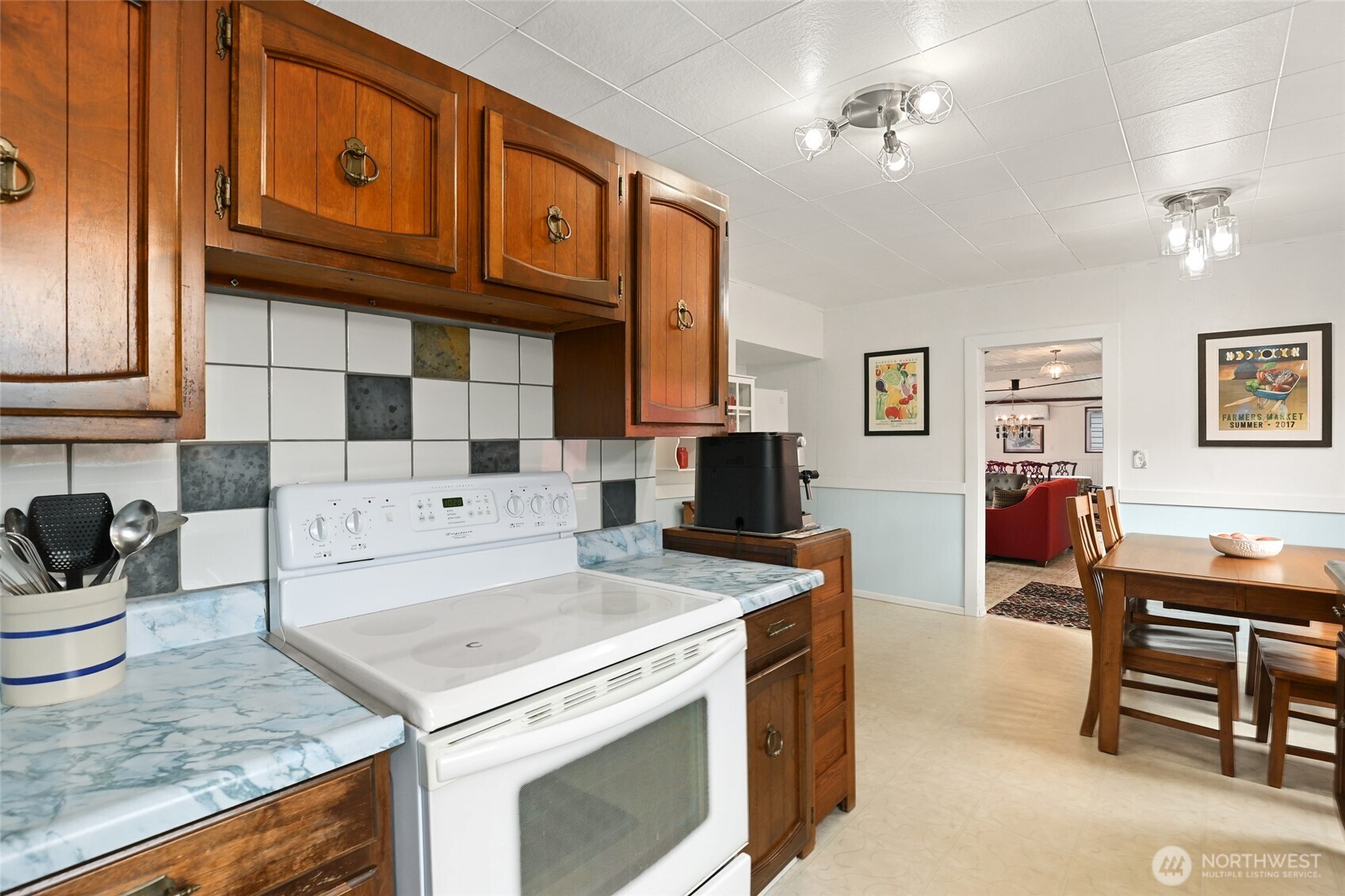 215 H Street Cosmopolis, WA 98537 - Photo 9 of 40 a kitchen with a stove and a cabinets