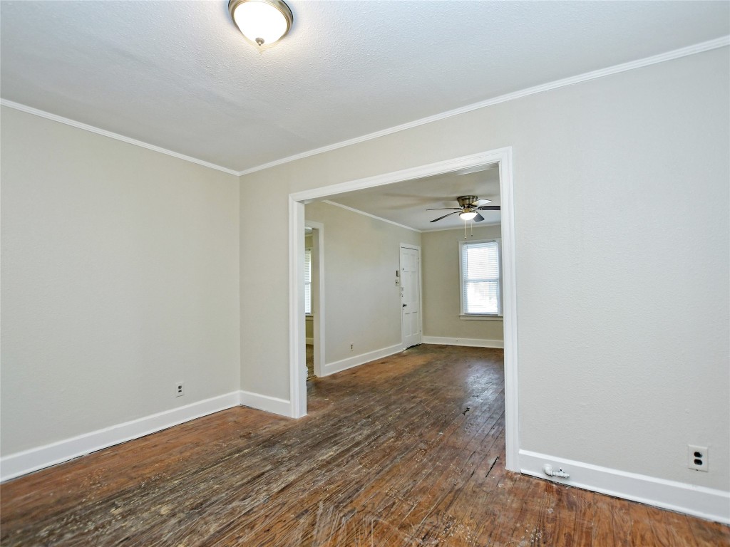 4305 Red River Street Austin, TX 78751 - Photo 6 of 9 Spare room with hardwood / wood-style flooring, baseboards, ornamental molding, and ceiling fan
