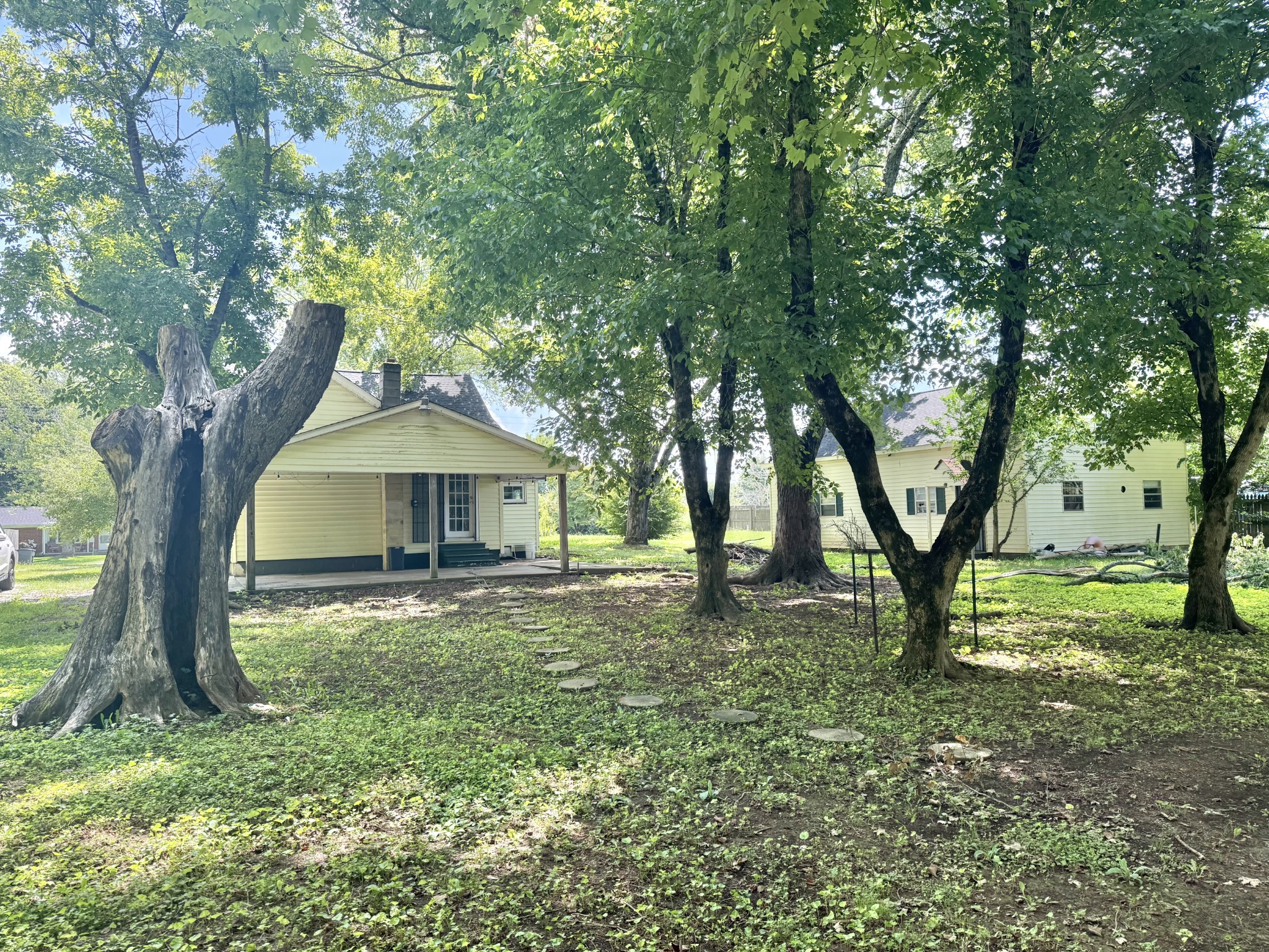 604 South Main Street St. Joseph, TN 38481 - Photo 2 of 10 a big house with large trees and wooden fence
