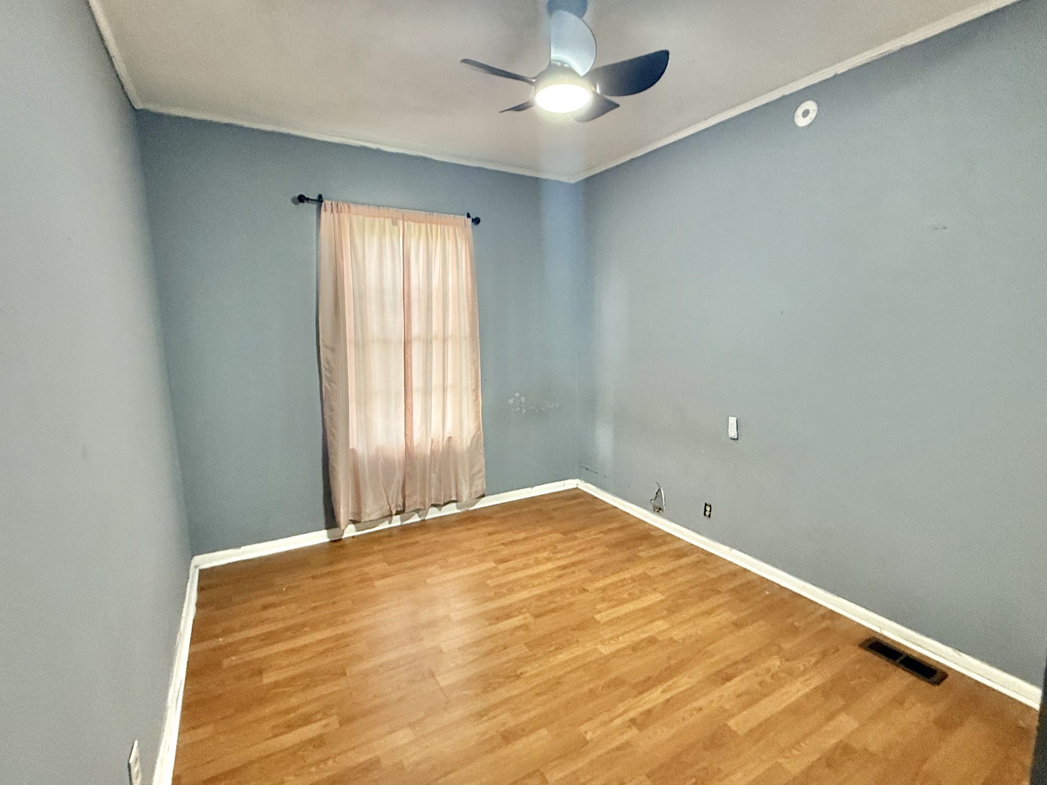 604 South Main Street St. Joseph, TN 38481 - Photo 8 of 10 a view of a big room with windows