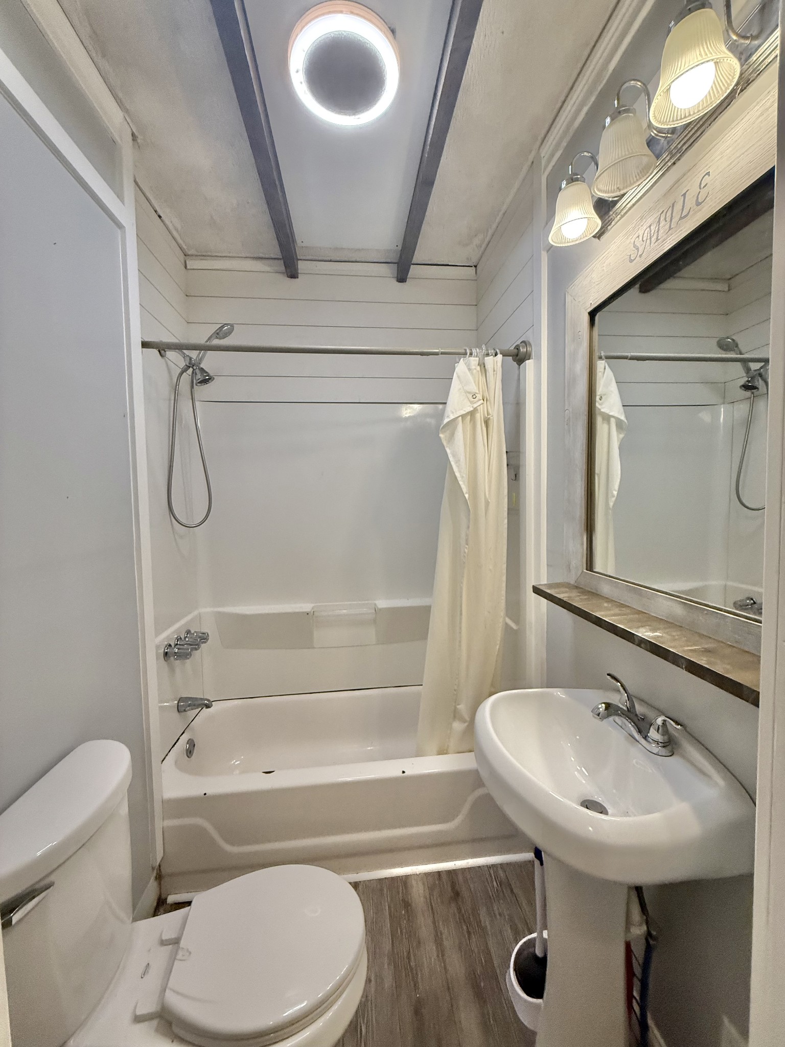 604 South Main Street St. Joseph, TN 38481 - Photo 10 of 10 a bathroom with a sink toilet and shower