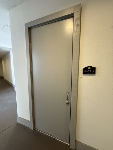 an empty room with a mirror