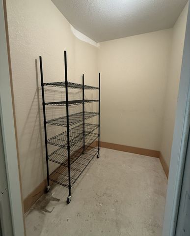 a view of a room with racks on the wall