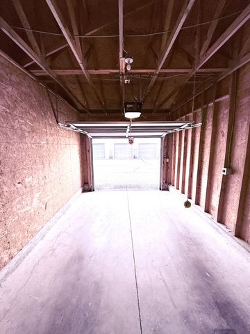 a view of a room with wooden walls