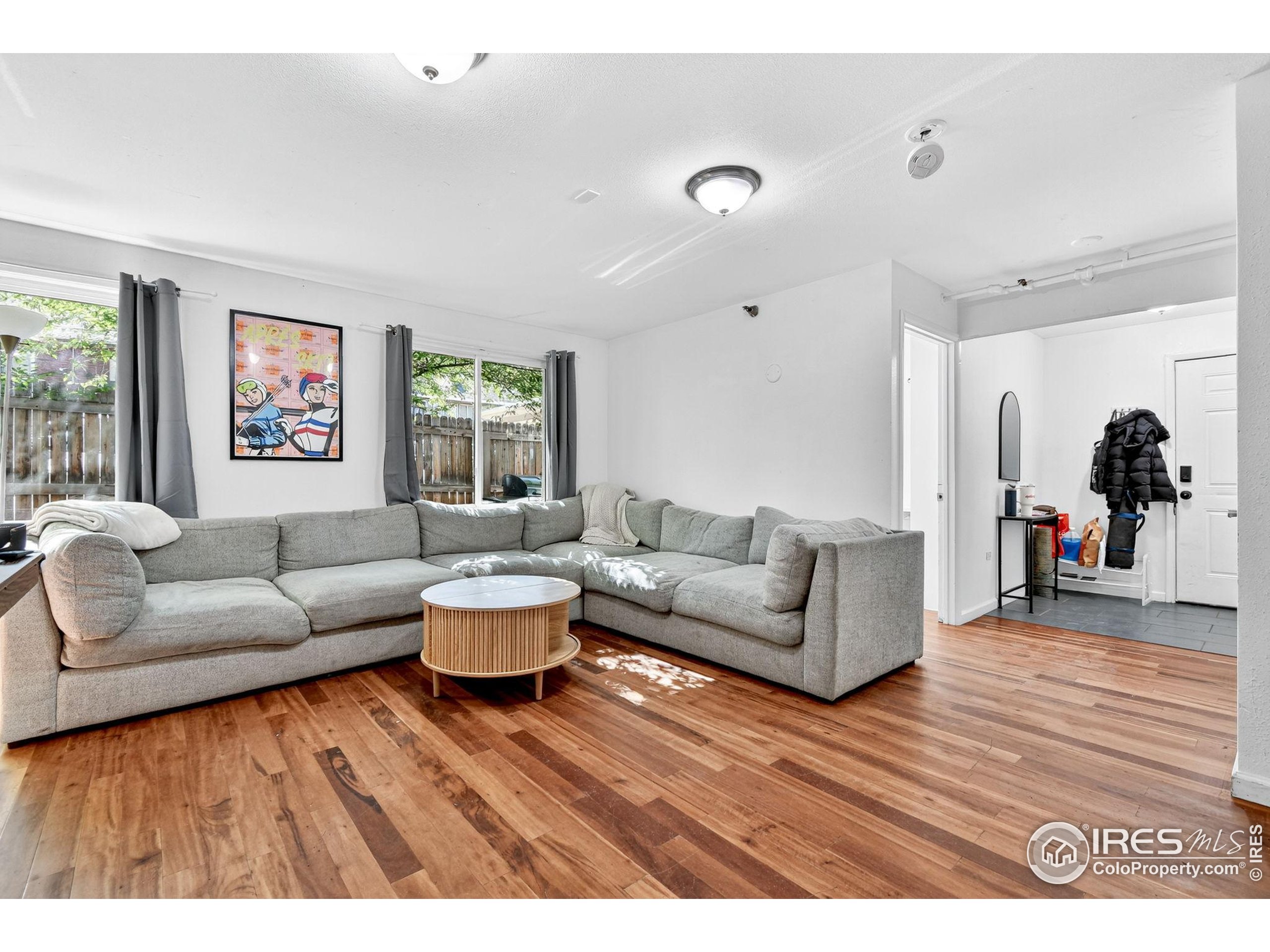 972 Pleasant Street Boulder, CO 80302 - Photo 14 of 36 a living room with furniture and a large window