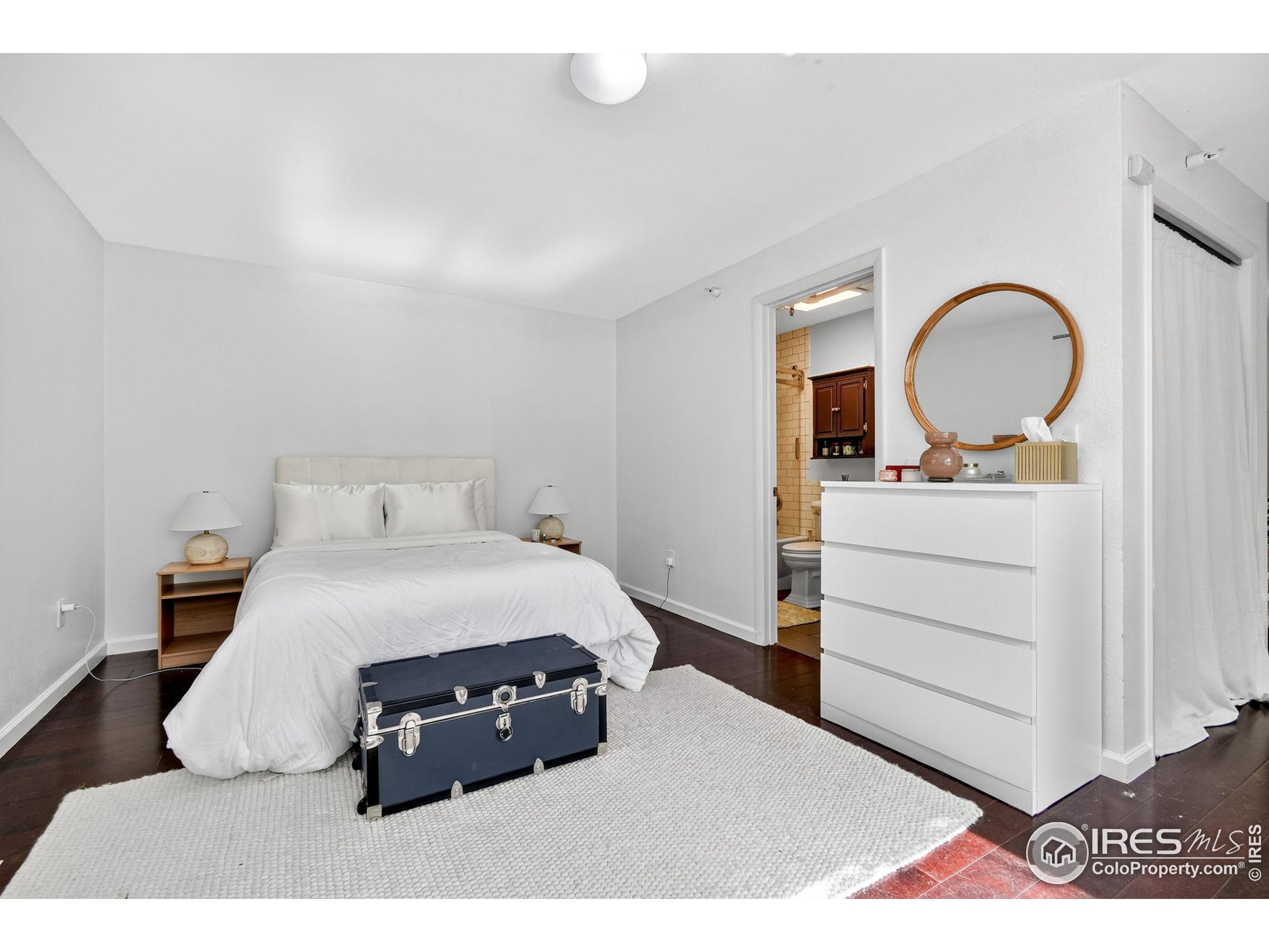 972 Pleasant Street Boulder, CO 80302 - Photo 22 of 36 a bedroom with a bed and a dresser