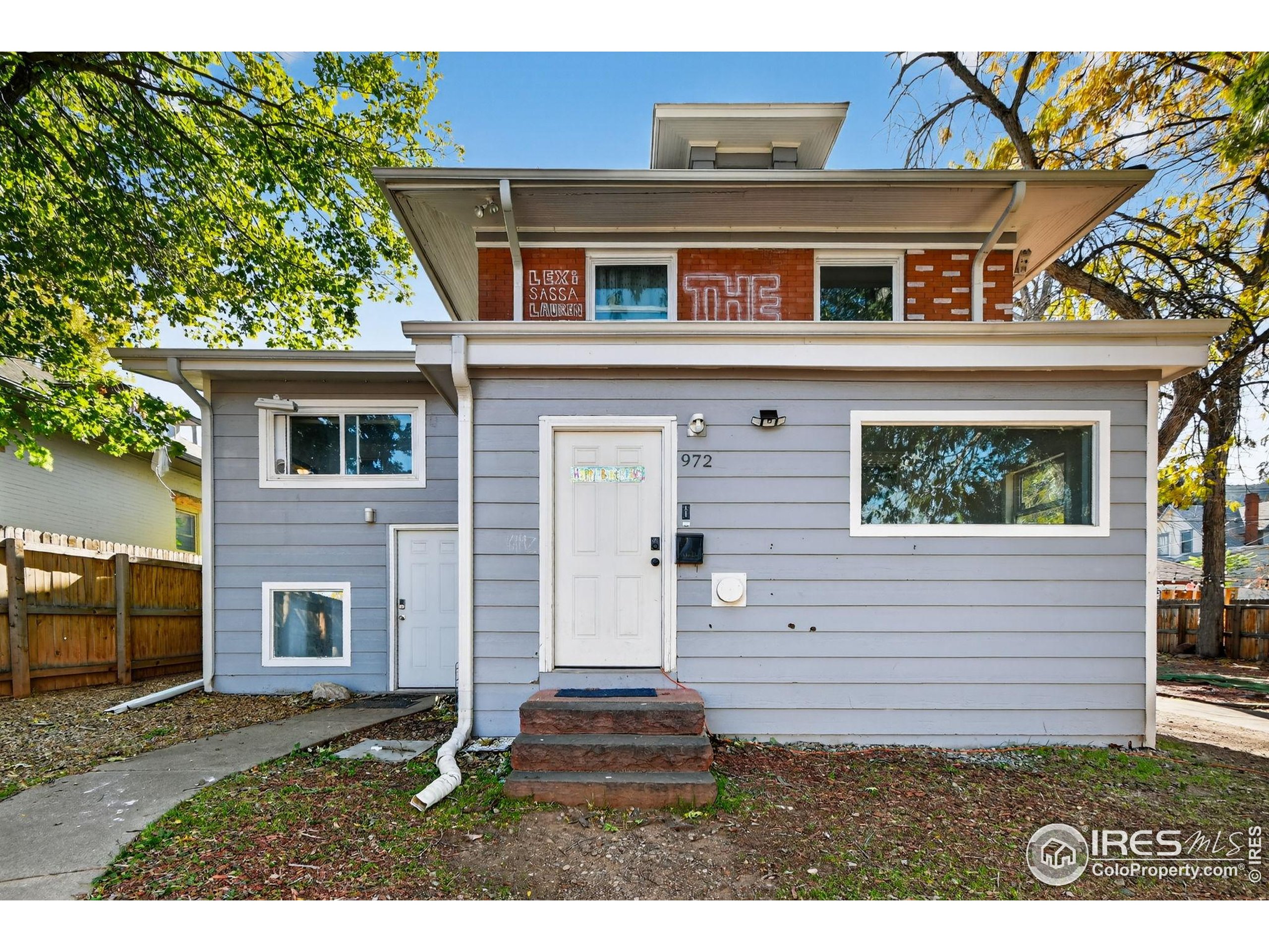972 Pleasant Street Boulder, CO 80302 - Photo 29 of 36 front view of a house with a yard