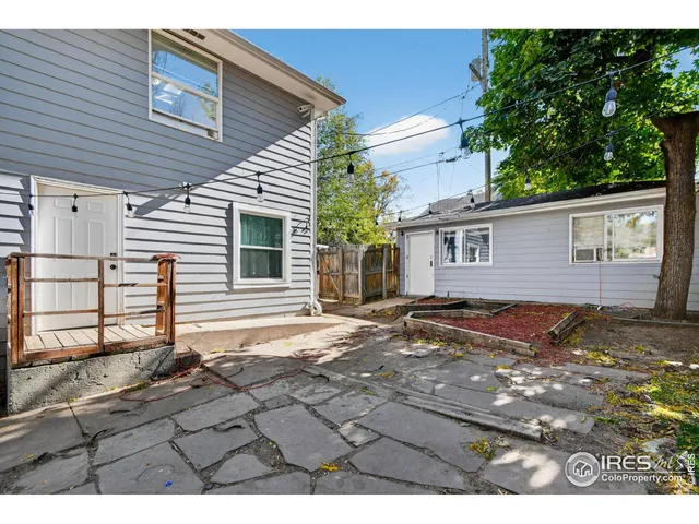 a view of a backyard of the house