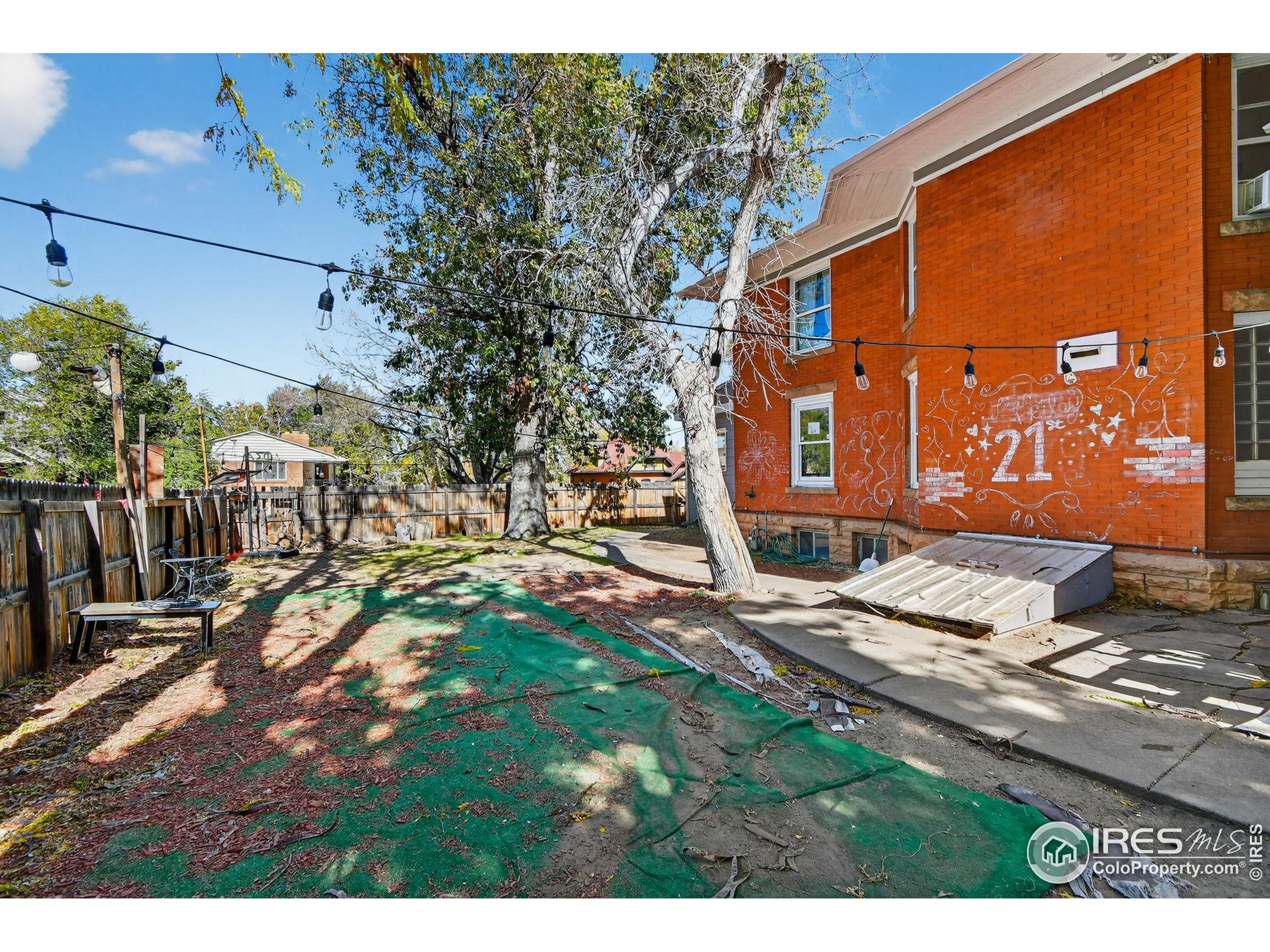 972 Pleasant Street Boulder, CO 80302 - Photo 35 of 36 a view of a house with a yard