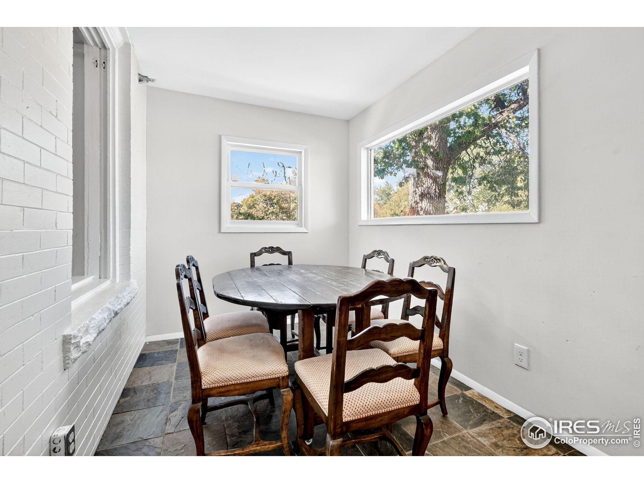 972 Pleasant Street Boulder, CO 80302 - Photo 7 of 36 a view of a dining room with furniture and wooden floor