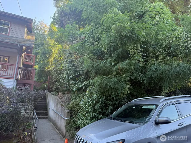 a view of a car parked on the side of a road