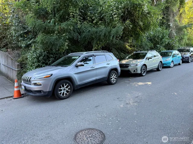 a couple of cars parked in a parking lot