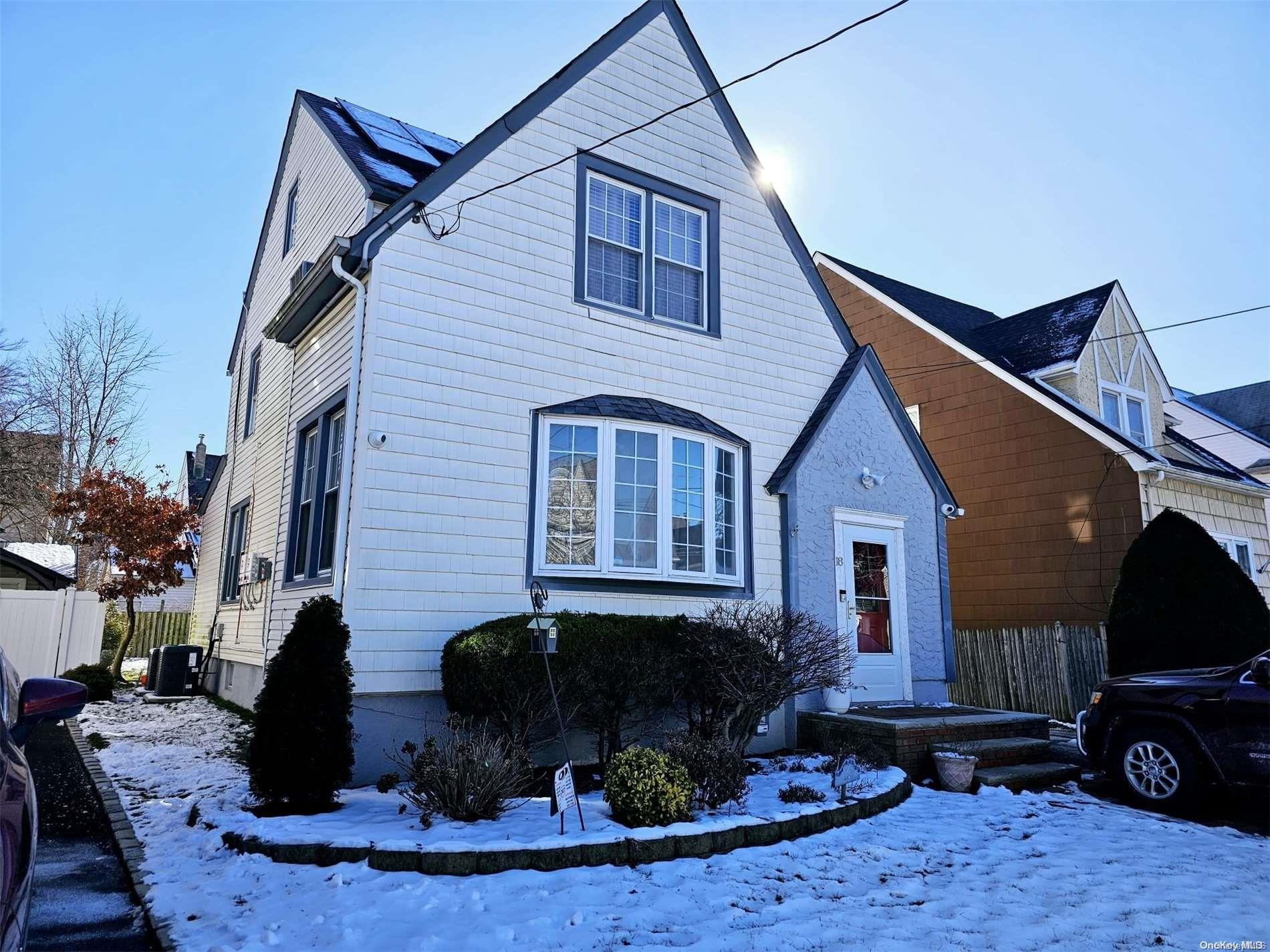 18 Kenmore Road Valley Stream, NY 11581 - Photo 1 of 1 a front view of a house with garden