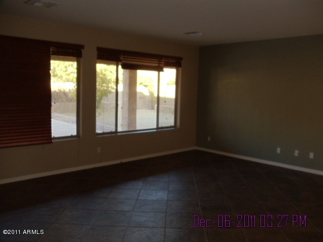 15236 West Boca Raton Road Surprise, AZ 85379 - Photo 4 of 18 a view of an empty room with a window