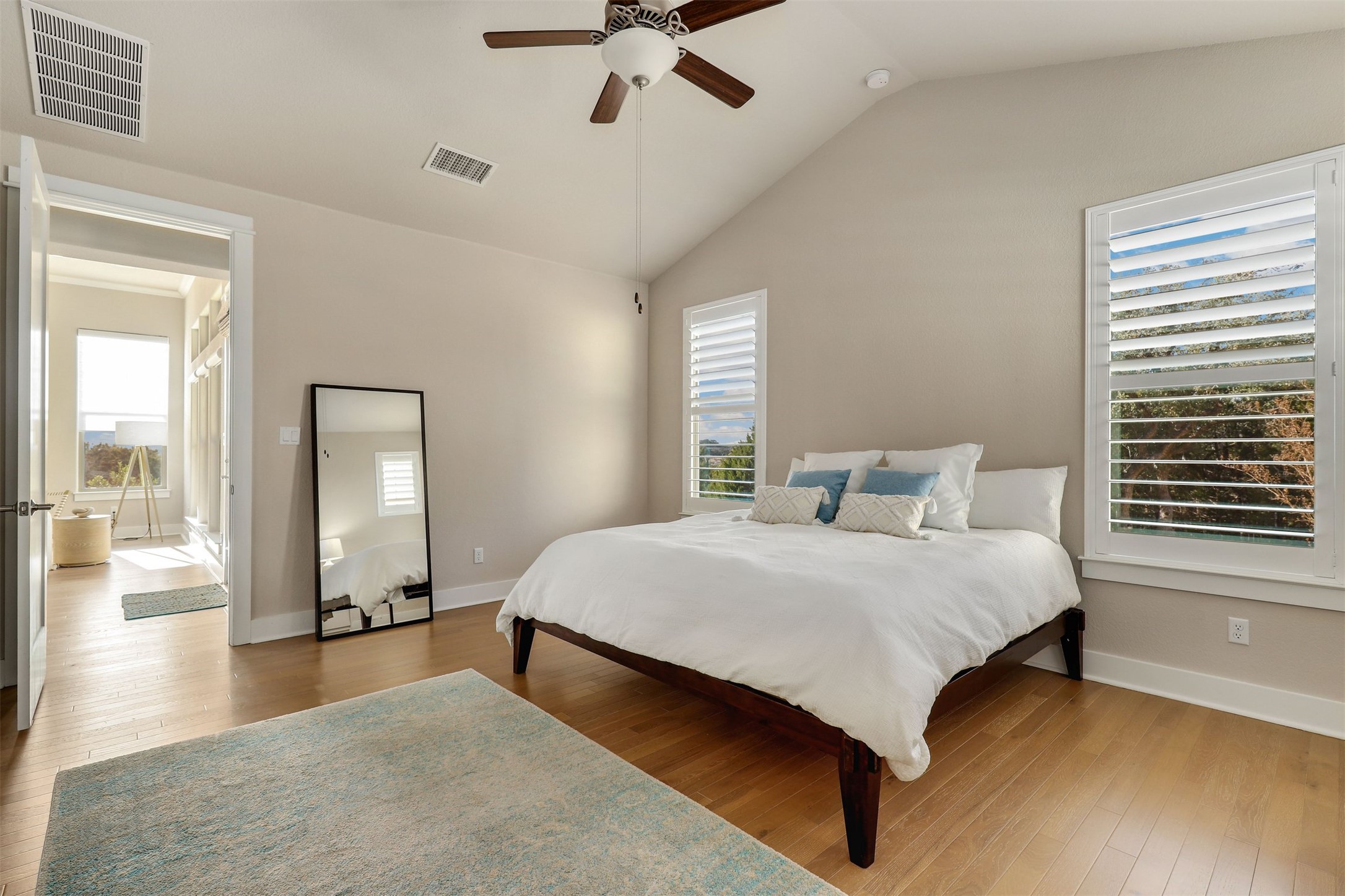 5502 Patagonia Pass Austin, TX 78738 - Photo 14 of 34 Bedroom with hardwood / wood-style flooring, lofted ceiling, and ceiling fan