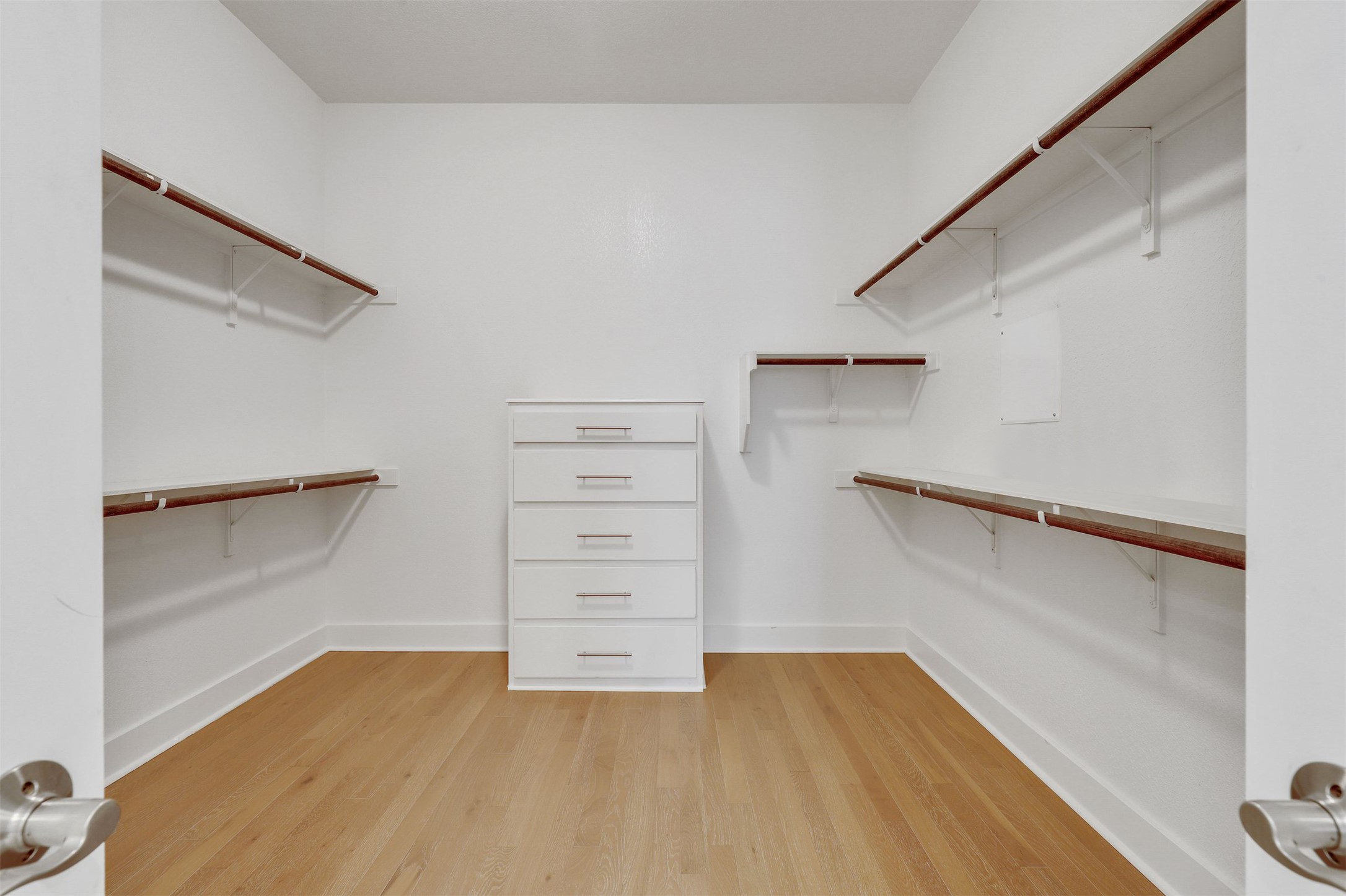 5502 Patagonia Pass Austin, TX 78738 - Photo 18 of 34 Walk in closet with light wood finished floors