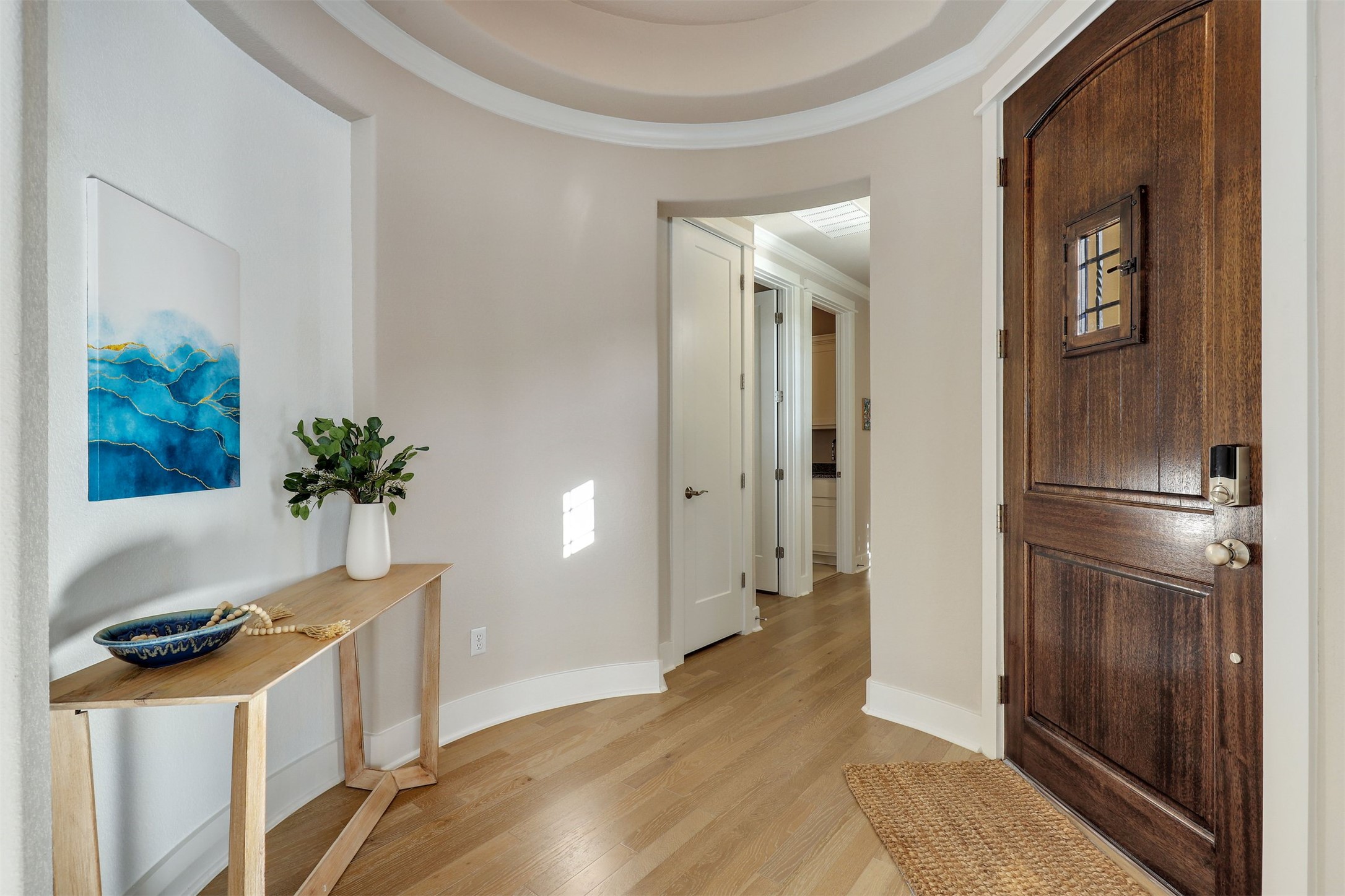 5502 Patagonia Pass Austin, TX 78738 - Photo 4 of 34 Hall featuring light wood-style flooring and ornamental molding