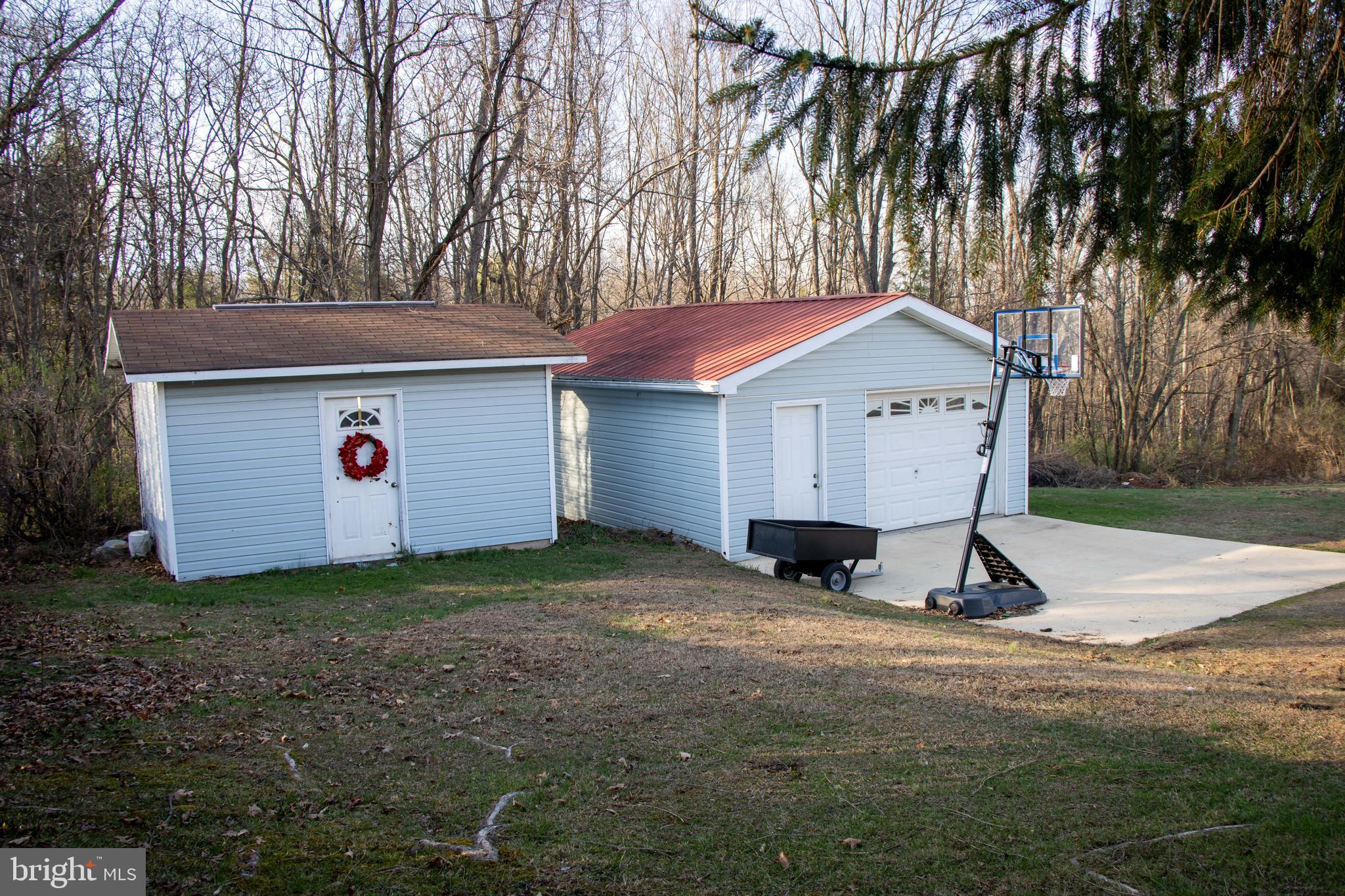 387 West Ridge Loop Road Romney, WV 26757 - Photo 31 of 58 Shed, Garage & concrete pad