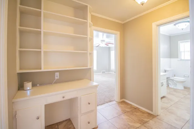 a bathroom with a sink a toilet and a shower