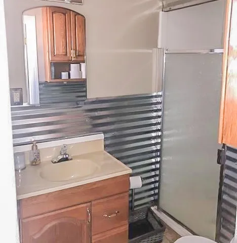 a view of a backyard with a tree