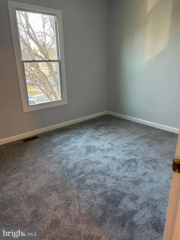 a white toilet sitting next to a bath tub