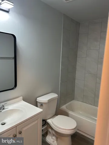 a bathroom with a toilet sink and bathtub