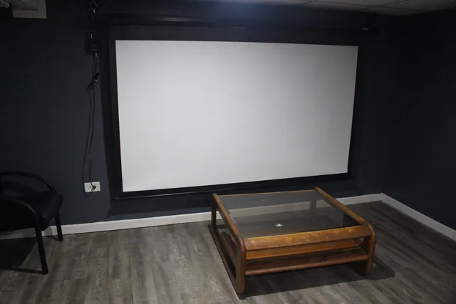 a sitting area with wooden floor