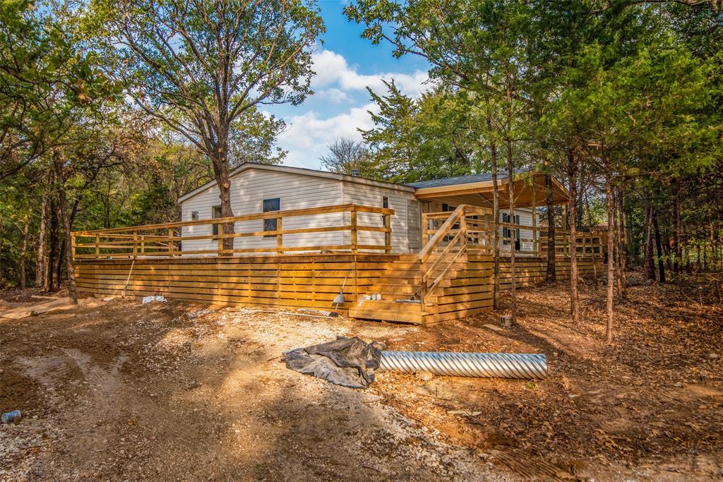 445 Locust Road Pottsboro, TX 75076 - Photo 1 of 1 a view of a house with backyard and tree