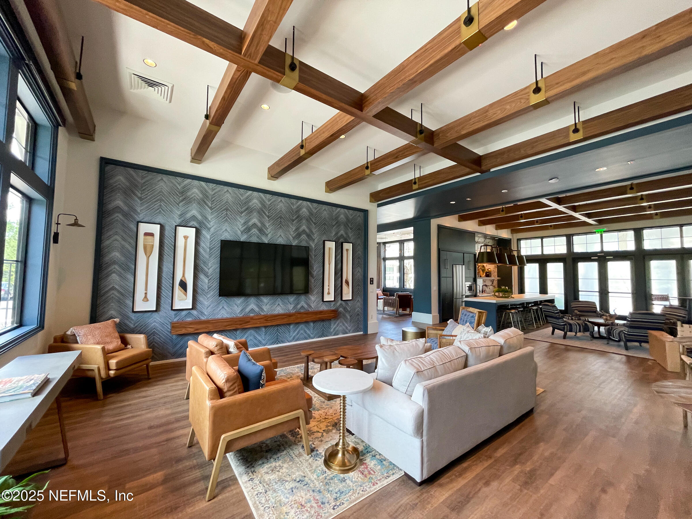 76024 Estuary Way Yulee, FL 32097 - Photo 17 of 42 a living room with furniture and a flat screen tv