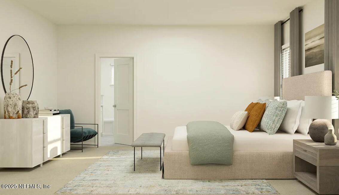 76024 Estuary Way Yulee, FL 32097 - Photo 28 of 42 a bedroom with a couch and a table