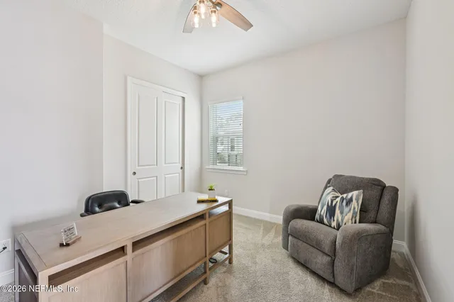 a view of a swimming pool with an outdoor seating