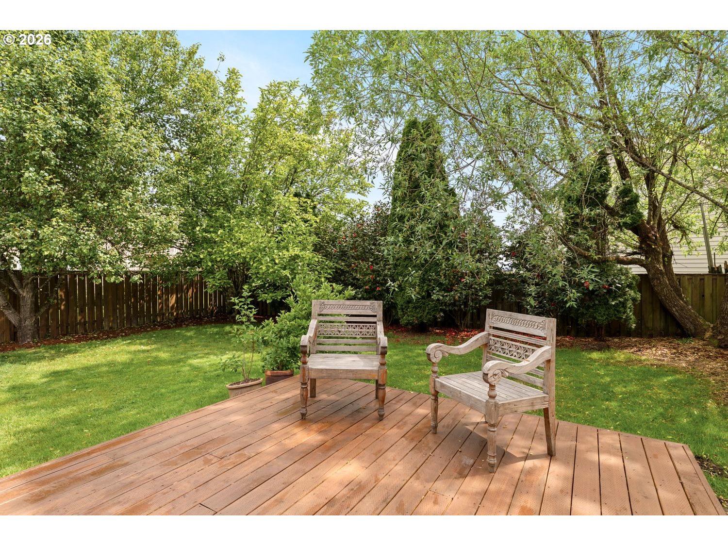 2519 Northwest 24th Circle Camas, WA 98607 - Photo 45 of 48 a view of a garden with wooden benches