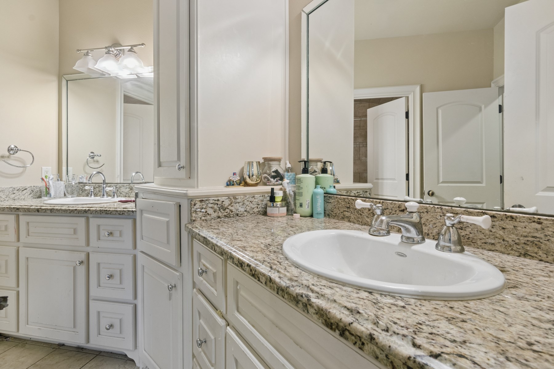 3818 Waterbend Cove Spring, TX 77386 - Photo 35 of 44 a bathroom with double sink and a mirror