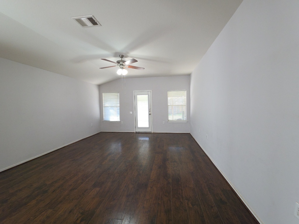 9005 Sun Shower Bend Austin, TX 78724 - Photo 8 of 20 wooden floor in an empty room with a window