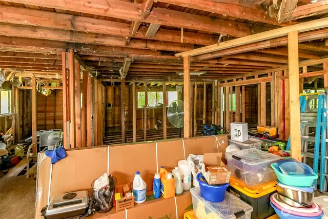 a view of a patio with table and chairs potted plants