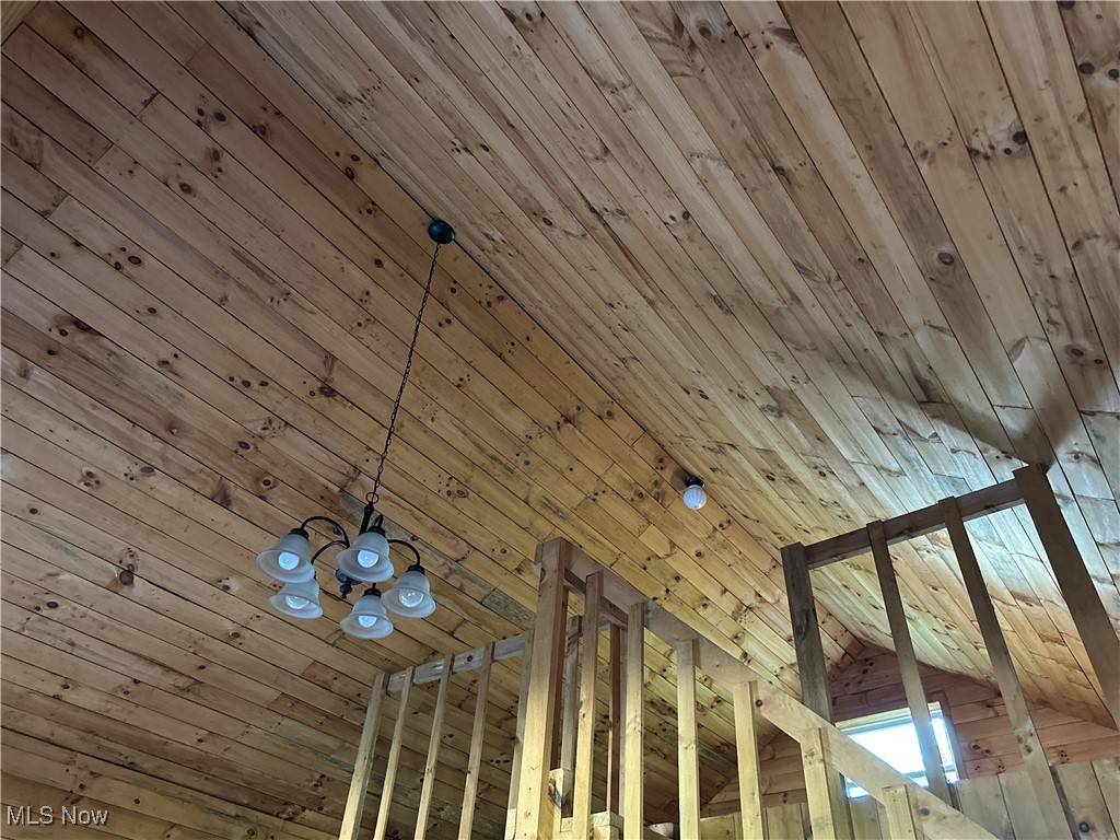 51036 Rochester Road Pleasant City, OH 43772 - Photo 18 of 22 Detailed view of wooden ceiling and a chandelier in cabin