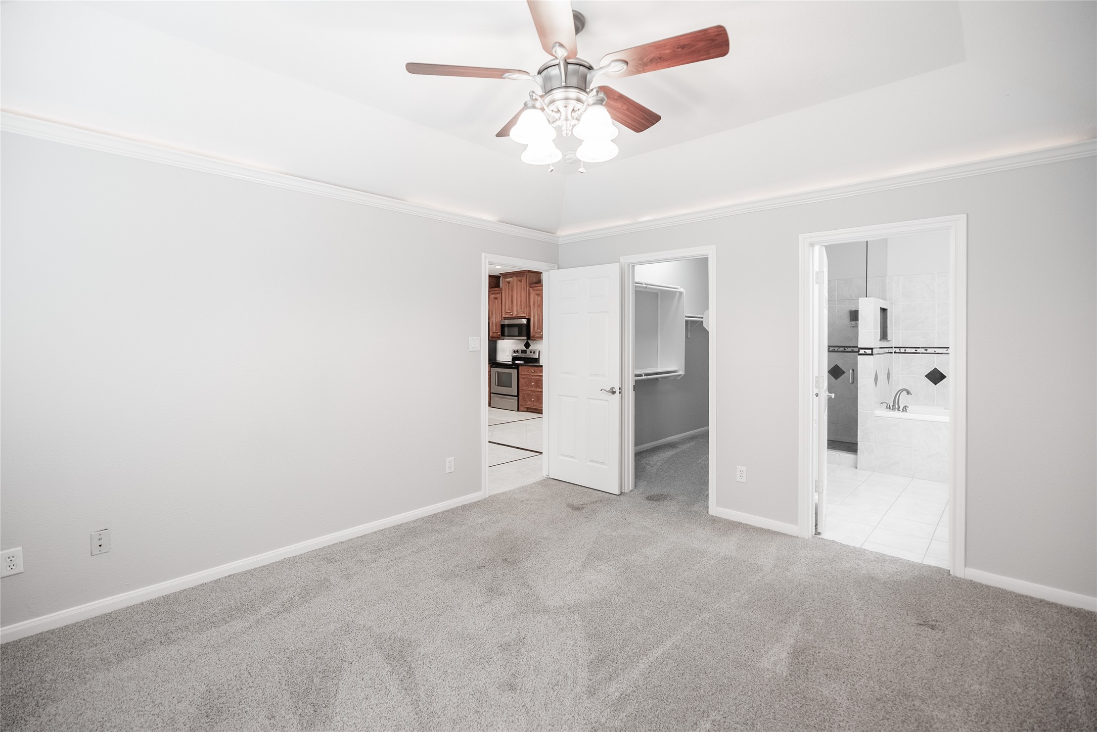 13165 Snow Lane, Unit 1 Willis, TX 77318 - Photo 13 of 34 an empty room with closet and a ceiling fan