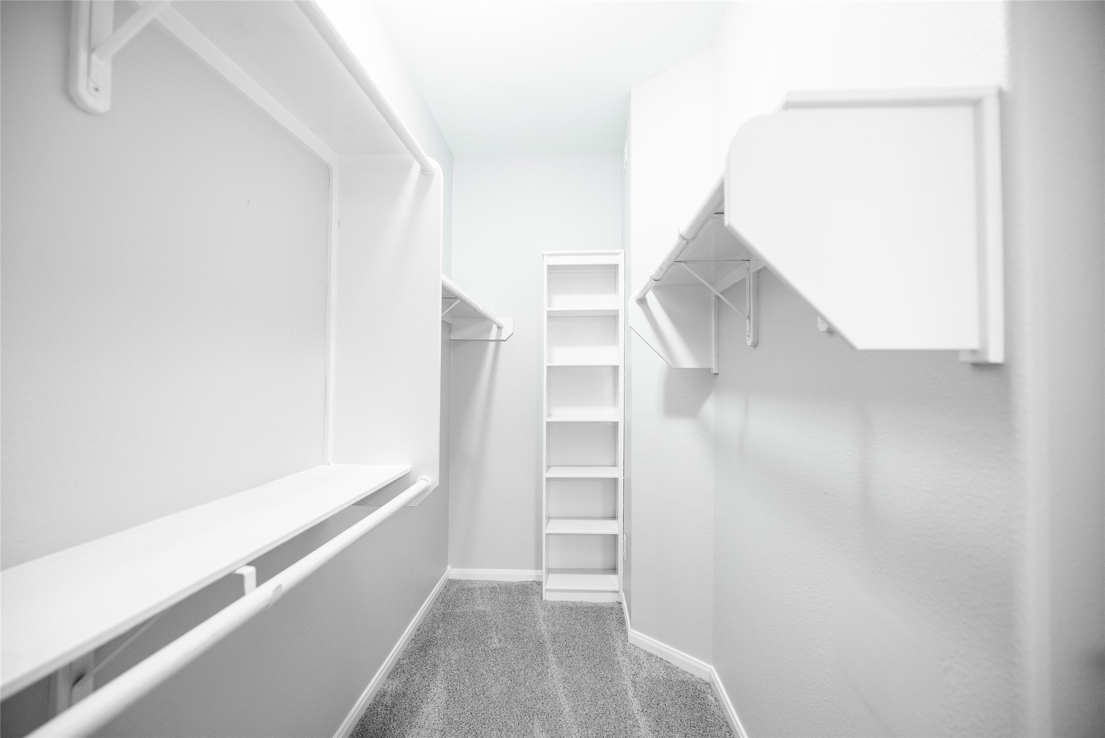 13165 Snow Lane, Unit 1 Willis, TX 77318 - Photo 14 of 34 a view of walk in closet with empty racks