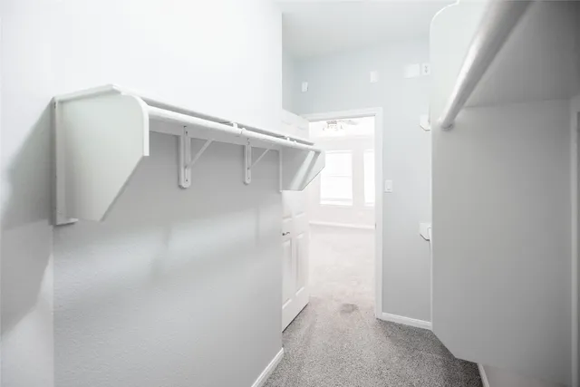 a bathroom with a granite countertop sink mirror vanity and toilet