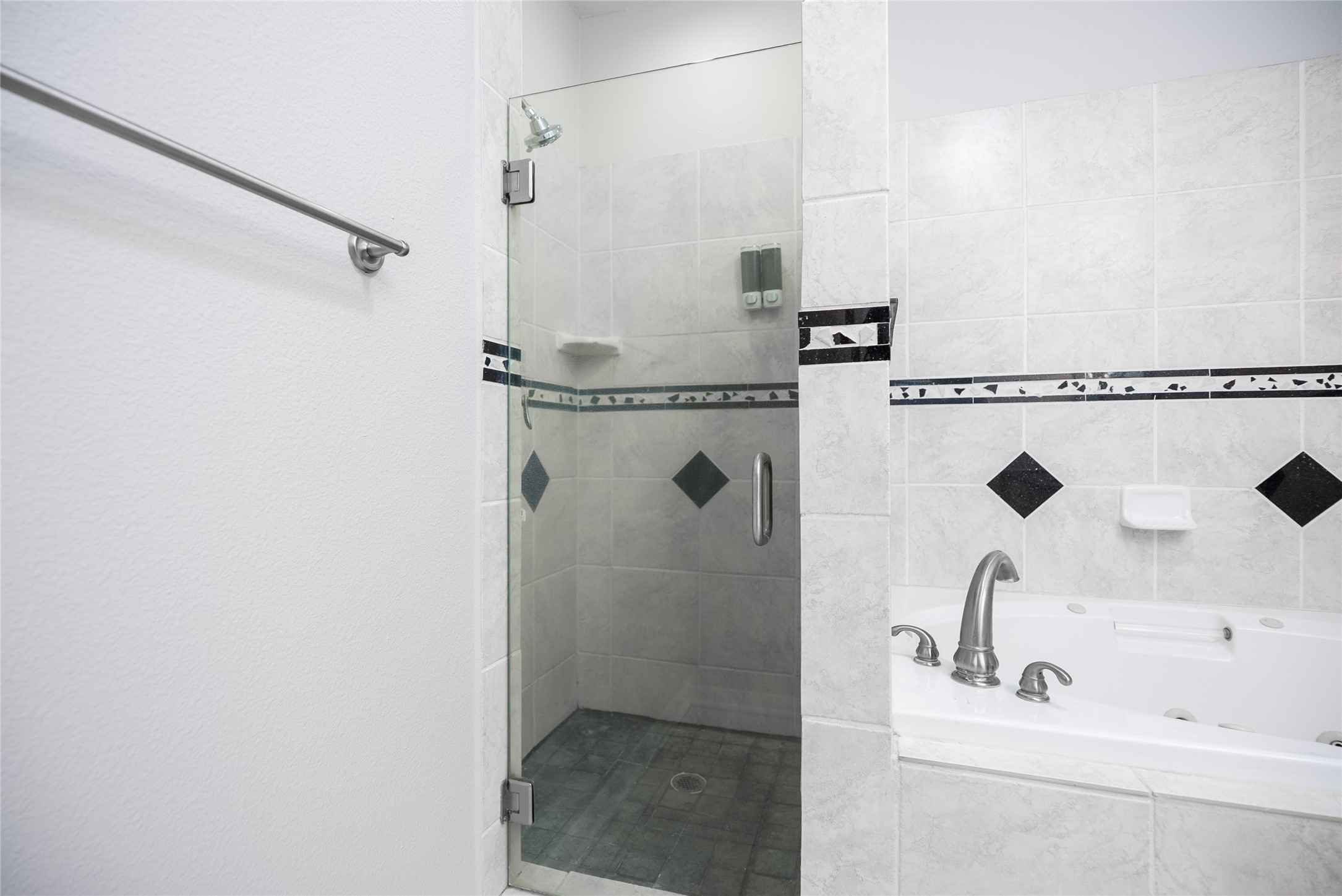 13165 Snow Lane, Unit 1 Willis, TX 77318 - Photo 18 of 34 a bathroom with a sink and a shower