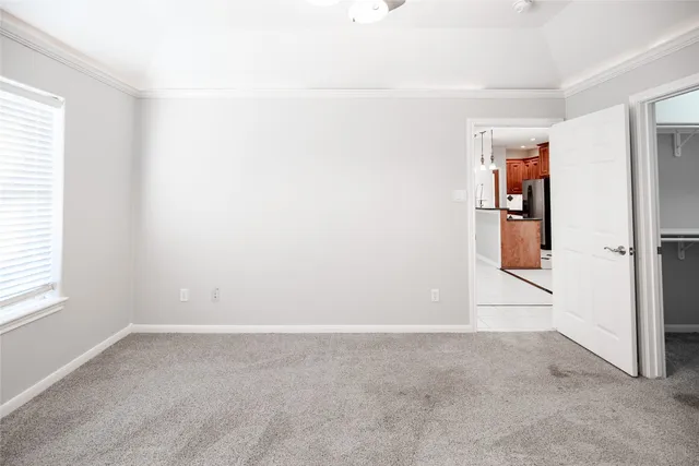 an aerial view of lake and residential houses with outdoor space
