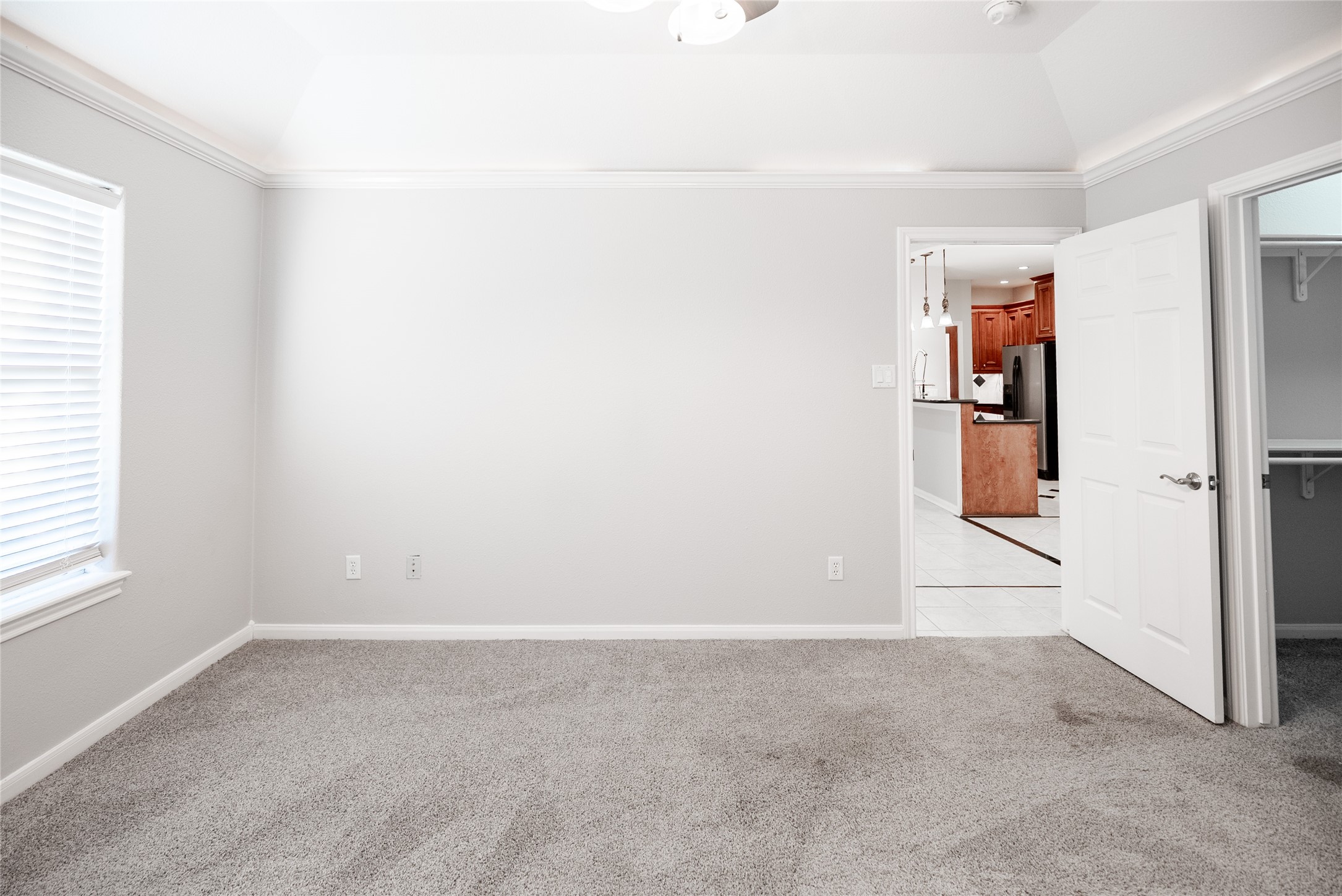 13165 Snow Lane, Unit 1 Willis, TX 77318 - Photo 22 of 34 an empty room with windows and closet
