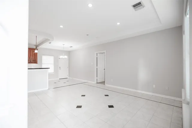 a kitchen with granite countertop a sink cabinets and stainless steel appliances