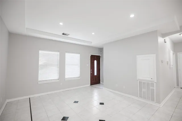 a view of an empty room and window