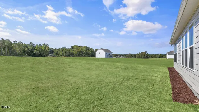 a view of a lake with a yard