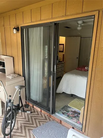 a bedroom with a bed and a mirror
