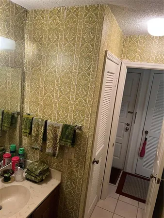 a bathroom with shower and window