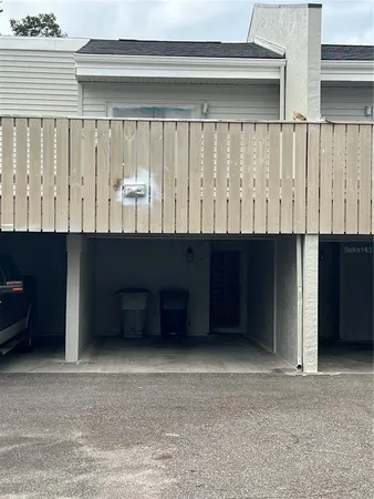 a living room with a black and white wooden cabinets